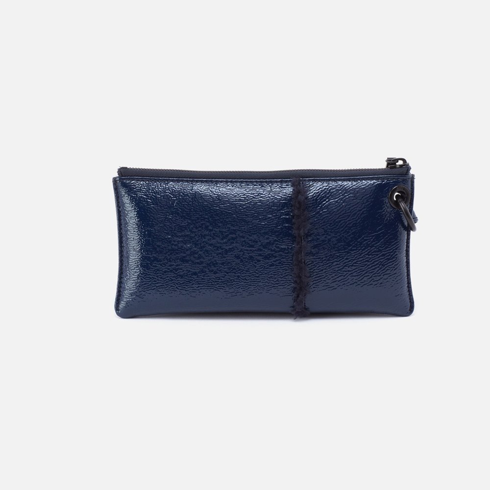 Hobo | Vida Wristlet in Pebbled Patent With Faux Shearling - Deep Indigo