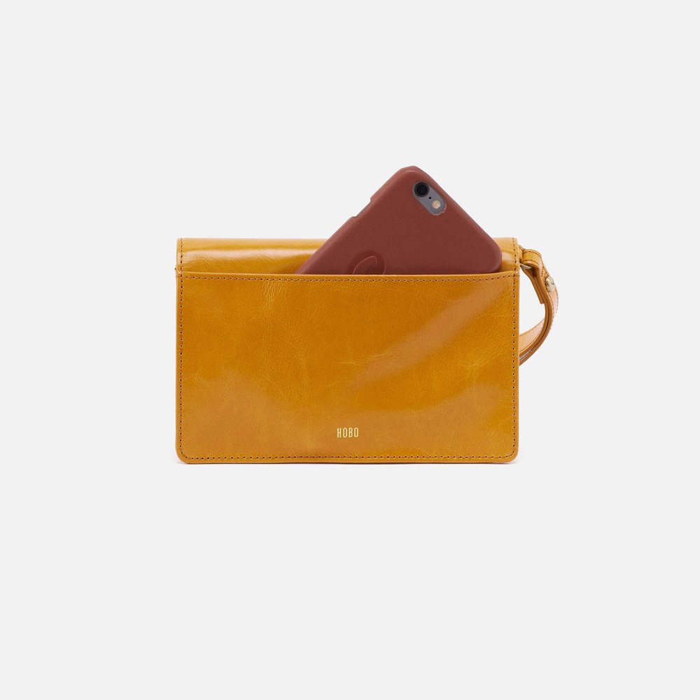 Hobo | Jill Wristlet in Polished Leather - Warm Amber